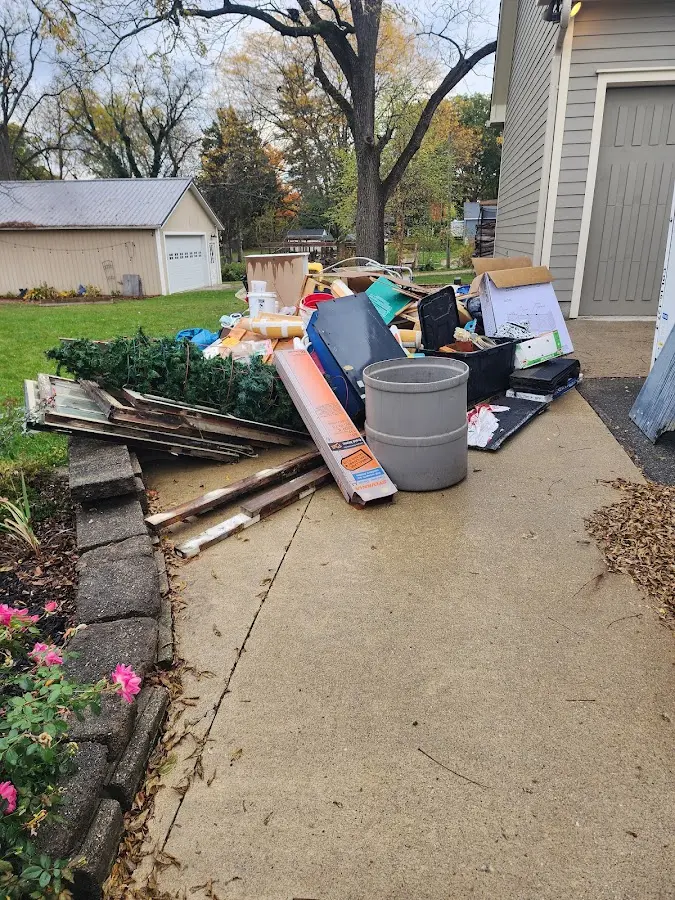 Dumpster being loaded with debris for Estate Cleanout Dumpster Rental in La Vale